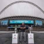 Henry with EURO and UCL Trophy with Wembley arch backdrop 2